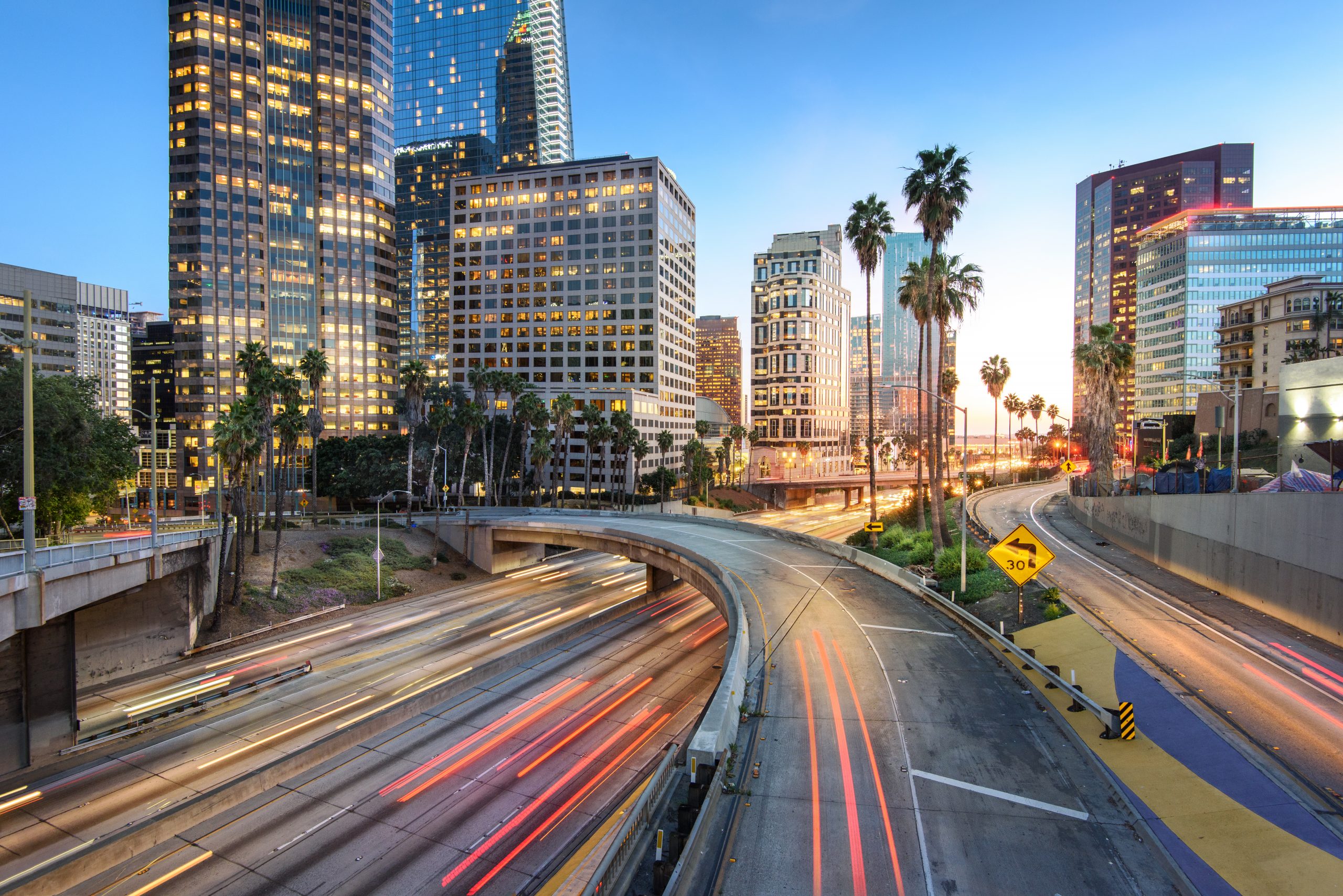 Downtown Los Angeles at sunset with car traffic light trails